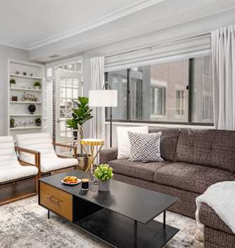 a kitchen with stainless steel appliances and white cabinets