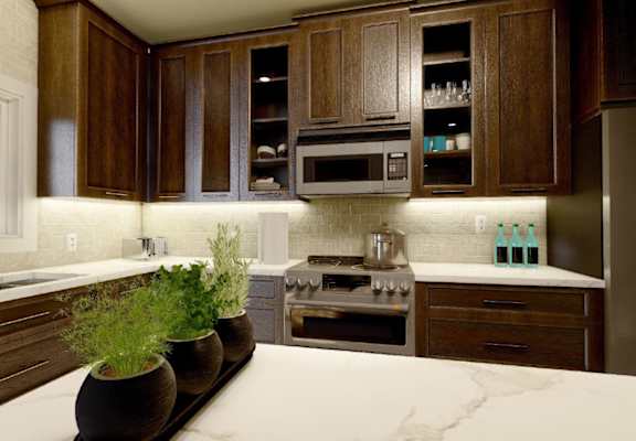 A kitchen with brown cabinets and a marble countertop.