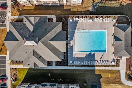 A large building with a pool in the middle of it.