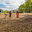 A playground with a blue slide and wooden structure. at Central on the Green Apartment Homes, Raleigh