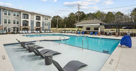 our apartments have a resort style pool with lounge chairs
