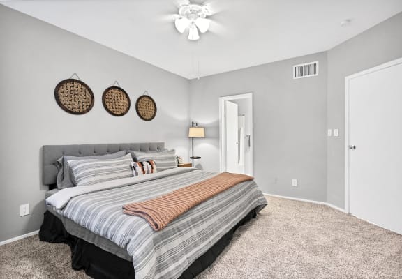 Bedroom with bed  at Augusta Court Apartments, Houston, Texas