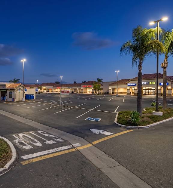 A parking lot with a FOO 4 LESS store in the background.