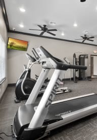 gym with exercise equipment and windows at the preserve at greatstone