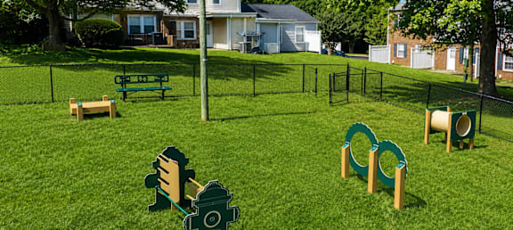 A playground with a green slide and a sign that says Green.