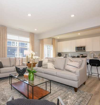 a living room with two couches and a coffee table at Jackson Run Townhomes, Whitestown, IN 46075
