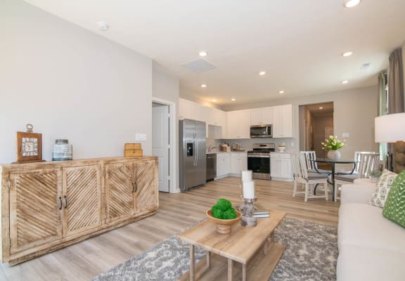 a living room with a couch and a table at Jackson Run Townhomes, Indiana, 46075