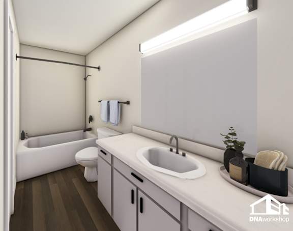 A modern bathroom with a white sink, toilet, and bathtub.