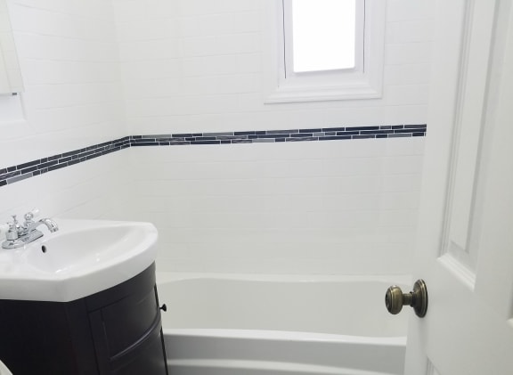 a bathroom with a toilet sink and bathtub