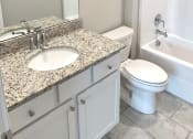 Thumbnail 14 of 60 - B1 (1-car) Guest Bath with sink, toilet, and shower, granite countertops