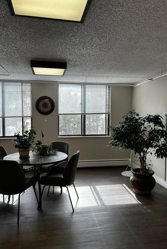 a living room with chairs and a coffee table