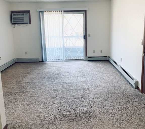 a living room with a couch and a table and a television