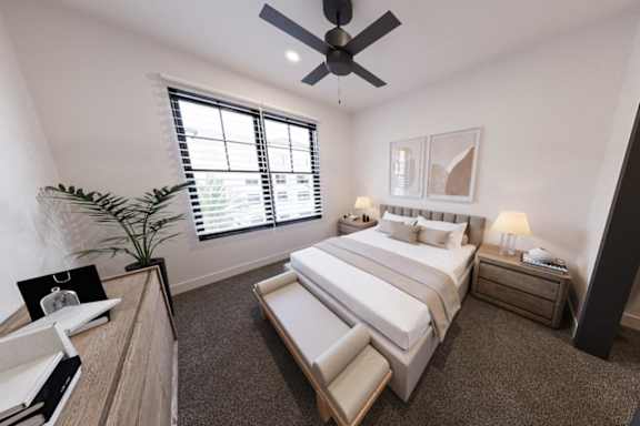 A bedroom with a large bed, a ceiling fan, and a window with blinds.