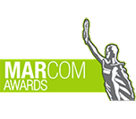 A logo for the MARCOM AWARDS features a statue of a person with an arm raised.