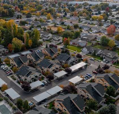 A suburban neighborhood with houses and trees.