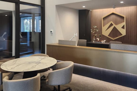 a table and chairs in a hotel lobby
