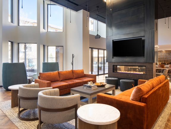 a living room filled with furniture and a large flat screen tv