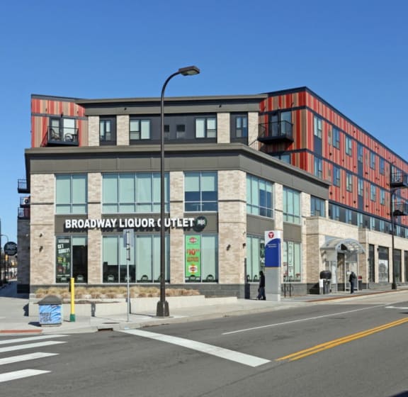 a large building on the corner of a city street