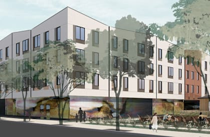 A modern building with a mural on the side is depicted in the image.
