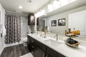 Master bathroom with wood-style flooring, and double vanity