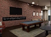 Thumbnail 5 of 6 - A room with a pool table and a television mounted on the wall.