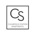 a black and white logo for clearfield station apartments