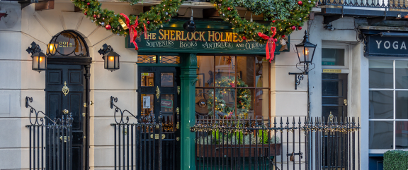 a facade of the sherlock holmes restaurant with christmas decorations on it
