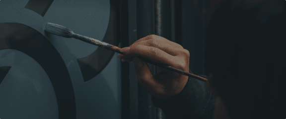 a person holding a brush in their hand