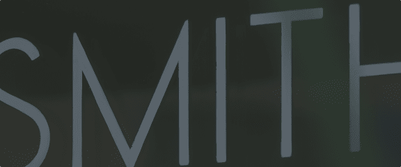 a black and white screenshot of the word win written on a dark background