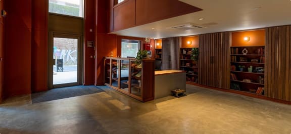 a lobby with a reception desk and a door