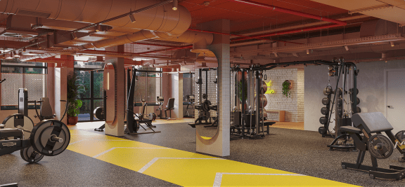 a workout room with weights and other exercise equipment in a building