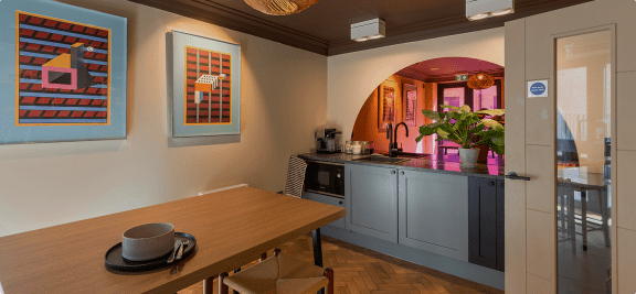 a kitchen and dining room with a table and a counter