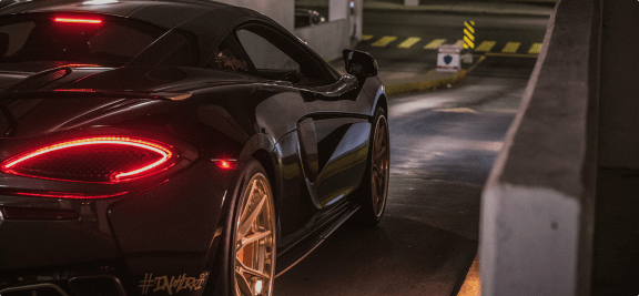 a car parked in a parking garage at night