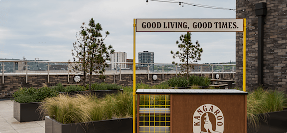 A sign that says "Good Living Good Times" is displayed on a yellow frame.