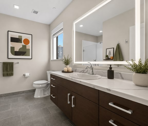 a bathroom with a sink and a mirror and a bedroom with a bed