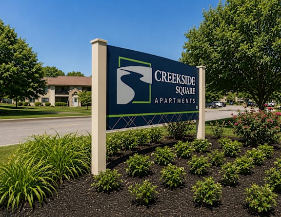 the sign at the entrance to bath farms with flowers