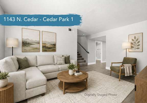 A kitchen with a refrigerator, sink, and cabinets. at Cedar Park Apartments, Chico, CA