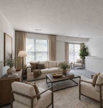 A living room with a couch, chairs, and a coffee table.