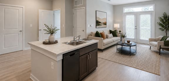 Professionally staged open-concept living room at Townes at Clarkston Centre, a pet-friendly apartment community in Clarkston, GA near Decatur.
