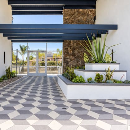 A modern house entrance with a checkered floor.