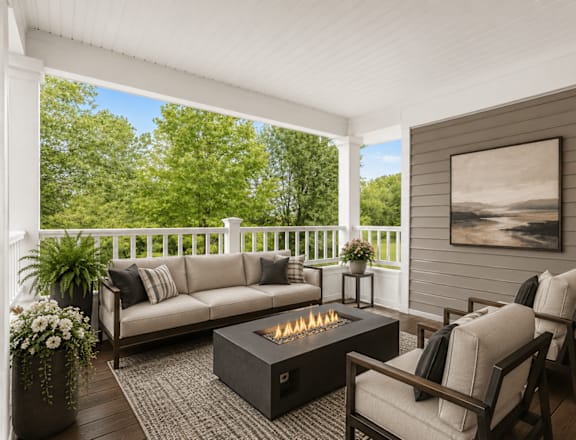 A cozy outdoor seating area with a fire pit in the center.