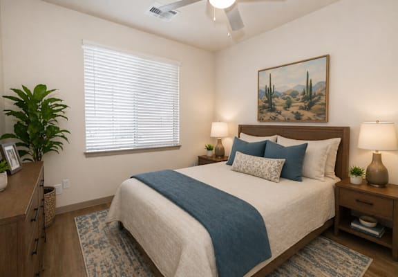 A bedroom with a bed, nightstands, and a painting on the wall.