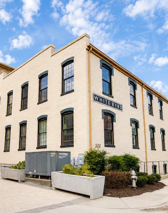 A white building with a yellow stripe and the words "Wright Street" on the front.