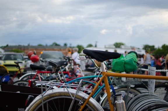 a group of bikes parked in a parking lot