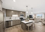 Thumbnail 17 of 22 - A modern kitchen with a dining area and a living room.