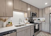 Thumbnail 14 of 22 - A modern kitchen with a black dishwasher and stove top.