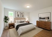Thumbnail 2 of 8 - A bedroom with a large bed, a nightstand, and a dresser.