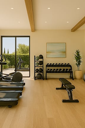 A gym with treadmills, weights, and exercise balls.