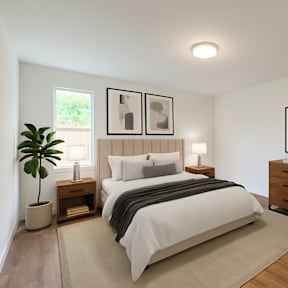A room with a sliding glass door and a wooden floor.