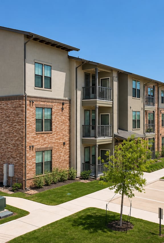 Modern apartment homes with private balconies, landscaped grounds, and reserved parking at One Preston Station.